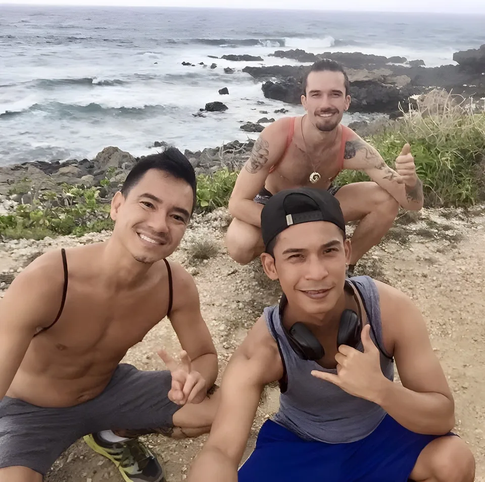 Trio at windward rocky coast