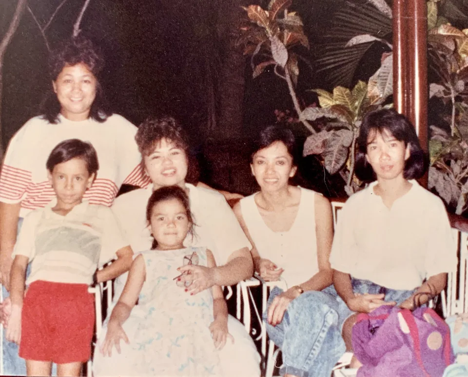 film-era family portrait, garden at night